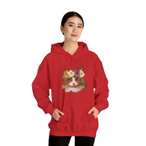 A cat wearing a flower crown Unisex Heavy Blend™ Hooded Sweatshirt