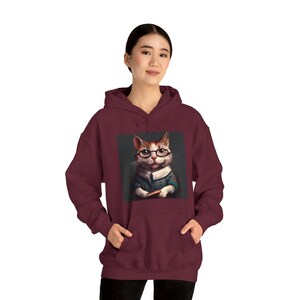 Gato bibliotecario Sudadera con capucha Heavy Blend™ unisex