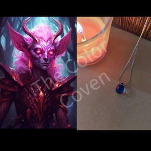 May include: A fantasy illustration of a pink-haired demon with red eyes and horns wearing a dark, ornate armor. The image is set against a dark, forested background. A close-up of a blue gemstone pendant on a silver chain.