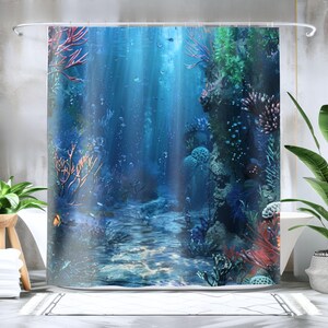 May include: A blue shower curtain with a colorful underwater scene. The curtain features coral, seaweed, and fish in a blue ocean setting.