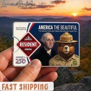 May include: A rectangular "America the Beautiful" pass featuring George Washington and Smokey Bear. The pass includes the text "Resident Annual" and "America 250". The background shows a sunset.