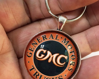 Vintage GMC General Motors Trucks orange and black Logo Sign 1.2" Diameter Chevy Keychain