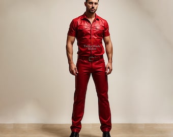 May include: A red leather shirt and pants outfit with a button-up collar and short sleeves. The outfit has a belt and the text "TailorMade Hides" is printed on the shirt.