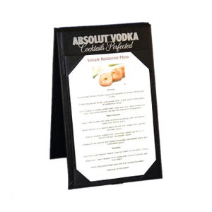 May include: A black, tri-fold menu holder with the text "ABSOLUT VODKA Cocktails Perfected" at the top. The menu includes a sample restaurant menu with starters, main courses, and desserts. The menu is displayed on a white background.
