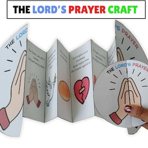 Op de afbeelding: Een gevouwen papieren knutselwerk met de titel "THE LORD'S PRAYER CRAFT" met illustraties van biddende handen, een duif en een gebroken hart. De tekst van het Onze Vader staat op de binnenpanelen.