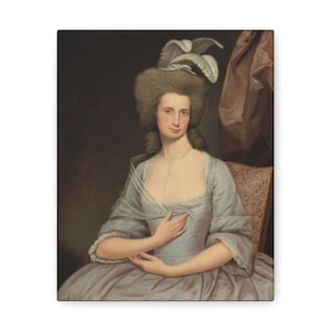 May include: A portrait painting of a woman wearing a light blue dress with a white lace collar and a feathered hat. She is sitting in a chair with a floral patterned upholstery. The background is a dark brown wall with a brown curtain.
