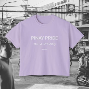 May include: A lavender cropped t-shirt with the text "Pinay Pride" in white, followed by text in a different font and "Manila" in white.