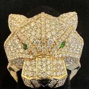 Stunning Panther Designed Ring crafted from 15 grams of gold with over 6 carats of diamonds. The panther eyes are rare demantoid garnets.