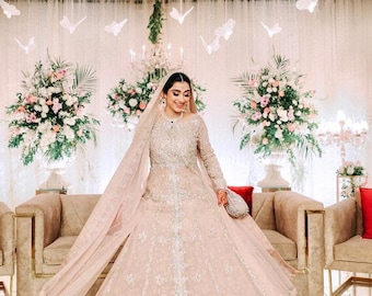 Hand made light peach bridal maxi gown with zardozi work for brides wedding and reception