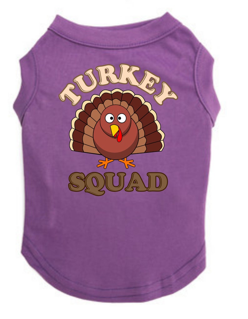 May include: Purple dog shirt with a cartoon turkey and the text "TURKEY SQUAD".