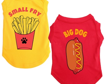 May include: Two dog t-shirts. One is yellow with a red cup of fries and the text "SMALL FRY". The other is red with a hot dog graphic and the text "BIG DOG".
