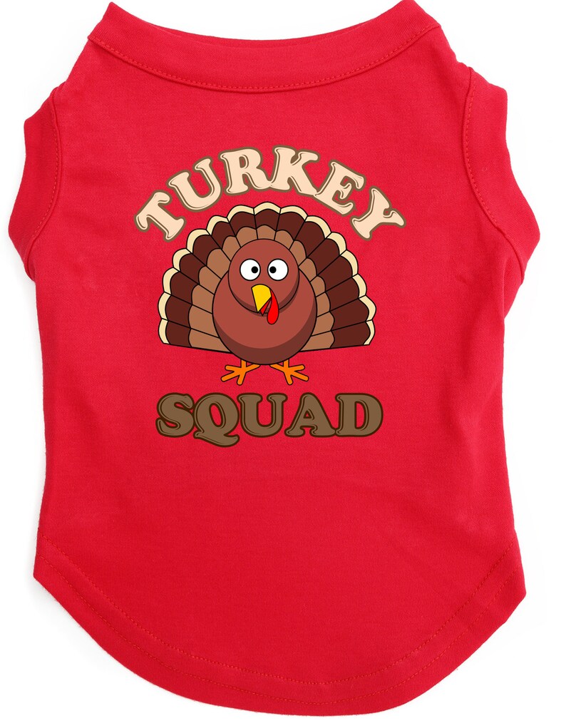 May include: Red dog t-shirt with a cartoon turkey graphic and the text "TURKEY SQUAD".