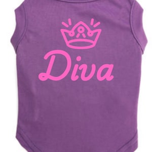 May include: Purple dog t-shirt with a pink crown graphic and the word "Diva" in a cursive font. The t-shirt is sleeveless and made of a soft material, designed for comfort and style.