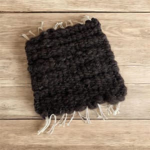 May include: A set of three ceramic mugs with a speckled, matte finish. The mugs are in shades of cream, light gray, and dark gray. Each mug has a simple, minimalist design, perfect for coffee or tea.