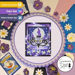 May include: A cross stitch pattern featuring a Chandelure character with the text Chandelure and Cursed Shadow, displayed in a round hoop with a scalloped lace edge, surrounded by purple and white artificial flowers and a Pokemon card.