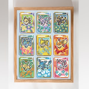 Könnte beinhalten: Eine gerahmte Kreuzstichstickerei mit einem Raster aus neun rechteckigen Karten, die jeweils eine verpixelte Kreatur in verschiedenen Farben wie Gelb, Lila, Schwarz, Blau, Orange, Grün und Pink auf hellblauem Hintergrund zeigen.