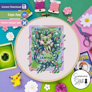 May include: A cross-stitch design of Sprigatito and Leafage, presented in an embroidery hoop. The image shows a colourful design with green, white, and blue hues. Crafting items such as thread, flowers, and a Pikachu figure are also visible.