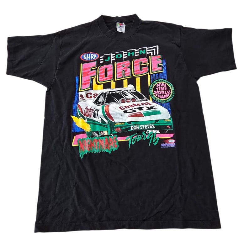 May include: Black vintage t-shirt featuring a race car graphic with the text "FORCE" in pink and the words "NHRA" and "Castrol GTX". The shirt also has the text "Don Steves Tours '96".