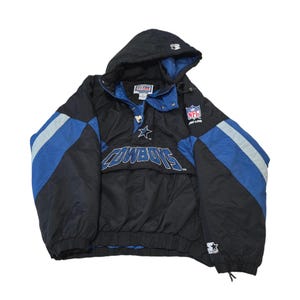 May include: Black and blue Dallas Cowboys NFL Pro Line hooded jacket. The jacket features the Cowboys logo and team name in white, with blue and silver stripes on the sleeves. It has a Starter logo on the sleeve.