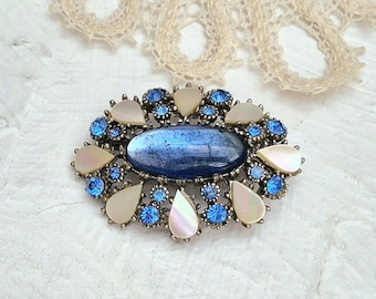Beautiful Vintage Oval Brooch with Mother-of-pearl Inserts, Blue Glass Cabochon and Blue Rhinestones.