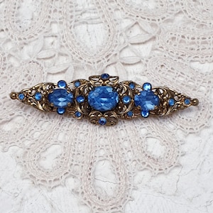 Antique Art Deco Czech Filigree Brooch in Antique Gold tone with Sapphire Blue Crystal Stones.  