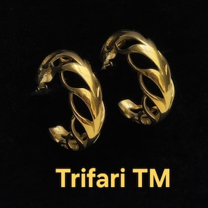 Trifari vergulde opengewerkte klemoorbellen. Gesigneerd Trifari TM