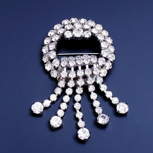 Beautiful Vintage Art Deco Round  Waterfall Brooch Rhodium plated with Clear Rhinestones.