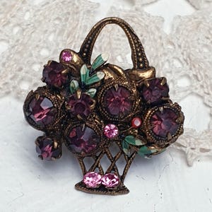 Beautiful Vintage Austrian Basket of Flowers Brooch in Brass tone with Amethyst Glass Rhinestones and Enamel.