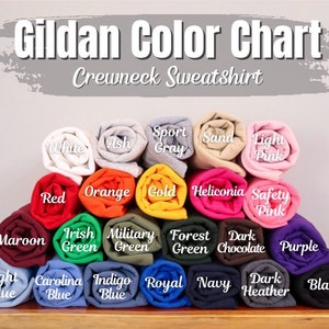 Op de afbeelding: Gildan Kleurenkaart voor Crewneck Sweatshirts. De kaart toont een verscheidenheid aan kleuren, waaronder wit, as, sport grijs, zand, licht roze, rood, oranje, goud, heliconia, veiligheids roze, donkerrood, Iers groen, militair groen, bos groen, donker chocolade, paars, lichtblauw, Carolina blauw, indigo blauw, koninklijk blauw, marine, donker grijs melange en zwart.