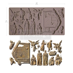 Puede incluir: Un molde de silicona gris con figuras religiosas, ángeles y elementos arquitectónicos. El molde mide 25,4 cm de largo y 12,7 cm de ancho. La imagen también muestra las figuras fundidas en color bronce.