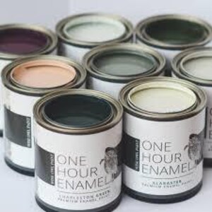 May include: Assortment of paint cans in various colors, including green, teal, gray, purple, and pink. Each can features the text "One Hour Enamel" and a sheep illustration.