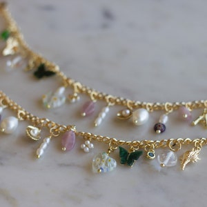 The Lavender Haze Charm Bracelet with Gold Seashell charms, Freshwater Pearls, Amethyst Gems & Gold Plated Figaro Chain (or Curb Chain)