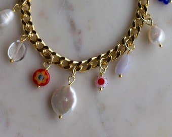 The French Girl Charm Bracelet with Coin Pearl, Freshwater Pearls, Blue Lace Agate Gems, Millefiori Charms on Gold Curb Chain