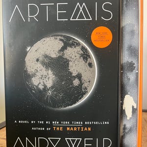 Artemis Special Edition by Andy Weir, Black and Silver Space Sprayed Edge, Stenciled Pages, Painted Custom Design Hardcover