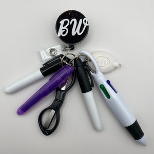Nurse badge reel Solid or Glitter w/ mini acces. Mini  highlighter, multi-color pen, pen light, dry erase marker, Perm marker, scissors.