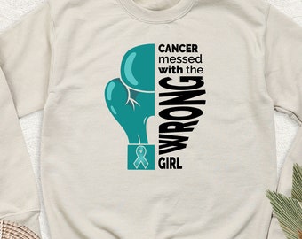 Sudadera "El cáncer se metió con la chica equivocada", camiseta de manga larga "Guerrera contra el cáncer de cuello uterino", sudadera con capucha con lazo verde azulado de concienciación, atuendo para el cáncer de ovario