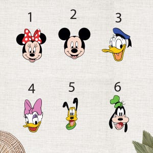 May include: A collection of six cartoon character faces. Minnie Mouse with a red polka dot bow, Mickey Mouse, Donald Duck in a blue sailor hat, Daisy Duck with a pink bow, Goofy, and Pluto with a green collar.