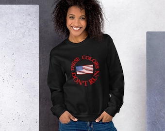 Patriotic Unisex Sweatshirt with an image of the American flag and the words, "These Colors Don't Run."