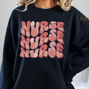 Pink Daisy Nurse Sweatshirt,Groovy Cute Nurse Shirt,New Nurse Gift,Nurse Graduation Gift,Registered Nurse RN Crewneck,Gift For Student Nurse