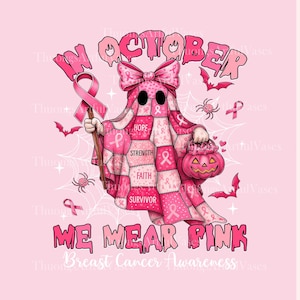 May include: Pink graphic featuring a ghost in a patchwork quilt costume holding a pink ribbon and a jack-o'-lantern. The text reads "In October We Wear Pink" and "Breast Cancer Awareness". Bats and spiders are also included.