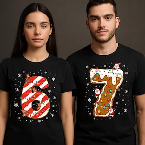 May include: Black t-shirts with festive Christmas-themed number designs. One shirt features a red and white striped number 6 with reindeer and lights. The other shirt displays a gingerbread-style number 7 with Santa figures and colorful lights.