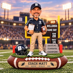 May include: A bobblehead figure of a coach wearing a navy blue shirt with a B logo, khaki pants, and a cap. The figure holds a clipboard and football, standing on a base shaped like a football with a plaque reading COACH MATT LEAD INSPIRE DEVELOP WIN.