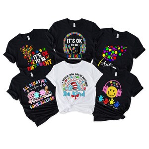 May include: Six different t-shirts with autism awareness designs. The designs include a giraffe, a puzzle piece, a rainbow, a cat in a hat, a dandelion, and a smiley face with headphones. The text on the shirts includes "It's OK to be different", "All behavior is a form of communication", "A world you can be anything", "Be kind", "Autism", and "Support Love Inclusion Respect".