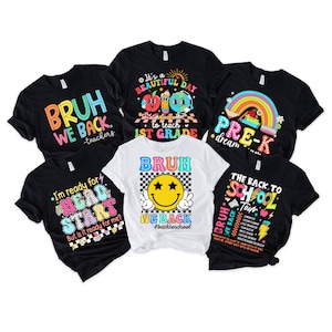May include: Six different t-shirts with back to school themes. The shirts are black and white with colourful graphics and text. The text on the shirts includes "Bruh We Back", "It's a Beautiful Day to Teach 1st Grade", "Pre-K Dream", "I'm Ready for Head Start", "Bruh We Back #BackToSchool", and "The Back to School Tour".
