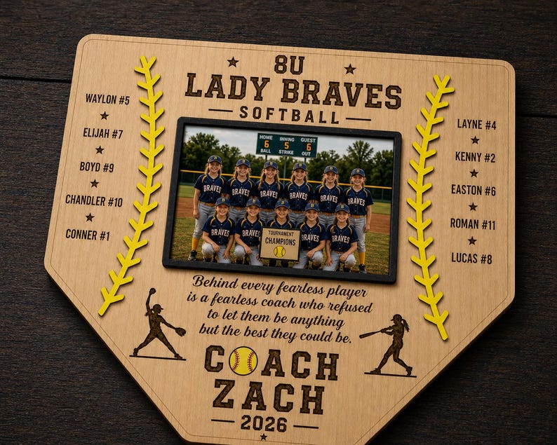 May include: A wooden baseball home plate-shaped plaque with a team photo. The plaque features the text "8U Lady Braves Softball" and player names. A yellow baseball and stitching design is on the plaque. The coach's name and year are also included.