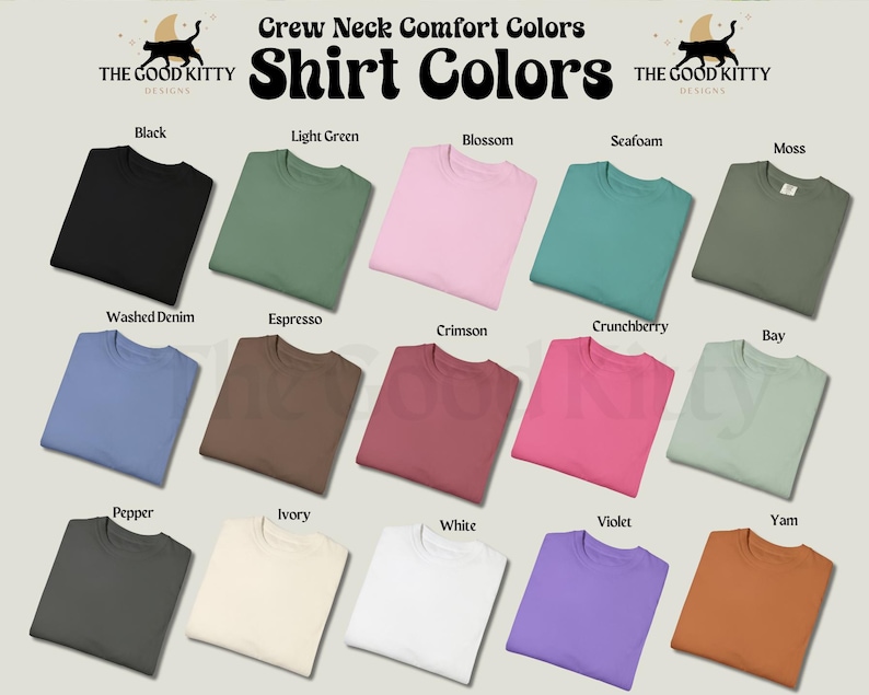 May include: A display of folded crew neck t-shirts in various colors, including black, light green, pink, and blue. The image includes the text "Crew Neck Comfort Colors" and "Shirt Colors", along with the brand logo "THE GOOD KITTY DESIGNS".