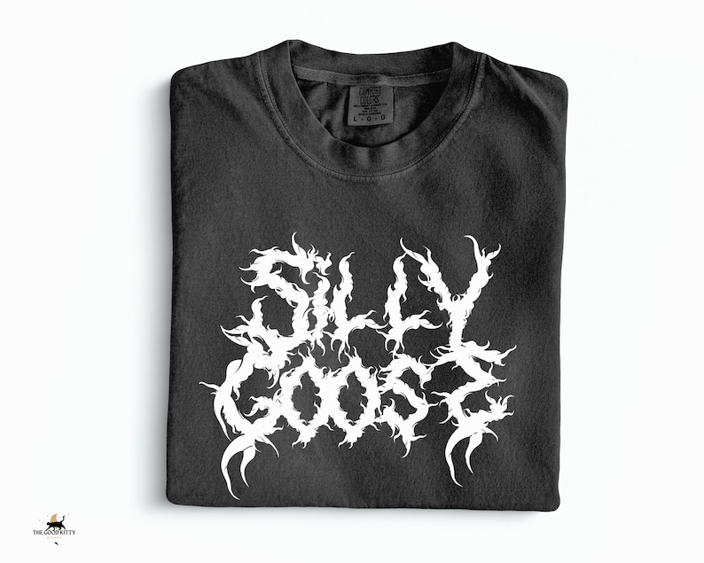 May include: Black t-shirt featuring the white text "SILLY GOOSE" in a gothic font. The shirt is folded on a white background. The Good Kitty logo is in the bottom left corner.