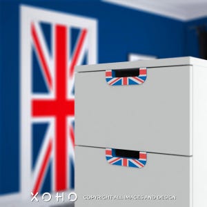 May include: A two-drawer gray cabinet with Union Jack flag accents on the drawer pulls. The background features a blurred Union Jack flag design on a door and a blue wall. The cabinet has the text "XOHO" and "COPYRIGHT ALL IMAGES AND DESIGN".