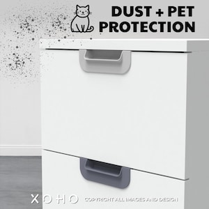 May include: White cabinet with two drawers and grey handles. The cabinet has a text overlay that says "DUST + PET PROTECTION".
