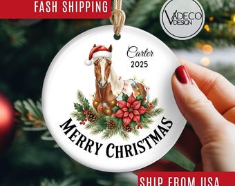 May include: White ceramic Christmas ornament featuring a horse wearing a Santa hat, surrounded by festive decorations and the words "Merry Christmas." The ornament includes the name "Carter" and the year "2025."